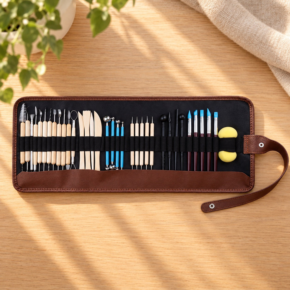 AI-styled: 37-Piece Clay Sculpting Tool Set on a warm oak worktable. Styling props are not included.
