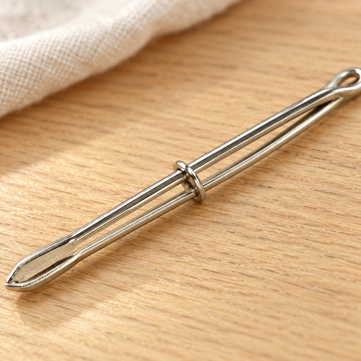 AI-styled: Metal Elastic-Threading Bodkin — close view of the original product details. Styling props are not included.