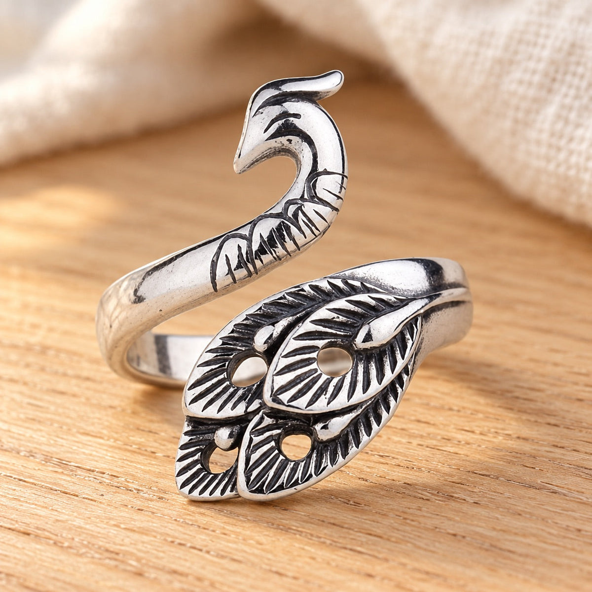 AI-styled: Silver-Tone Yarn Guide Ring on a warm oak craft desk. Styling props are not included.