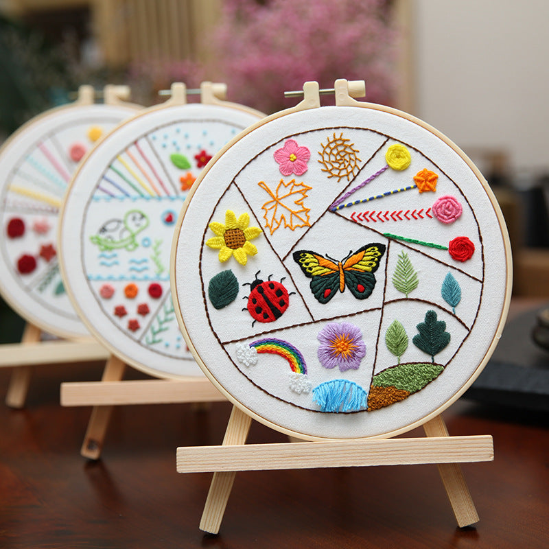 Three-Design Embroidery Practice Kit — supplier photo of finished project examples; kit requires assembly